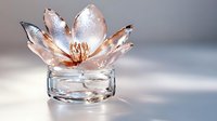 Elegant crystal lotus flower candle holder with rose gold accents on neutral background, perfect for home decor, spa ambiance, and meditation spaces.