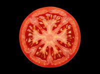 Fresh red tomato slice isolated on transparent background, ready for food design, stickers, print on demand, T-shirts, clipart, and sublimation projects.