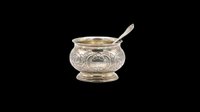 Ornate silver condiment bowl with matching spoon, isolated on transparent background. Ready for design use on t-shirts, clipart, stickers, print-on-demand products, and sublimation projects.