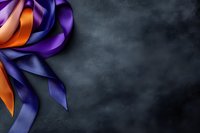 Purple and orange satin ribbons arranged decoratively in corner against dark textured background, creating elegant composition with copy space for text.