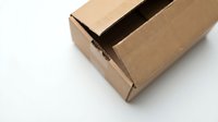 Open brown cardboard shipping box on white background isolated for packaging design and e-commerce delivery concepts.