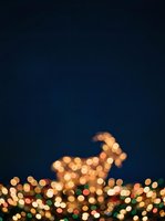Upward arrow formed by golden bokeh lights against dark blue background, symbolizing growth, success, and rising profits for business and financial concepts.