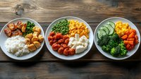 Healthy meal prep bowls with rice, tofu, vegetables and proteins on wooden background, balanced portions of colorful ingredients for weekly planning.