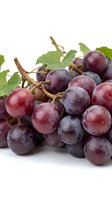 Fresh red grapes cluster with green leaves isolated on white background for healthy eating and wine making concepts.