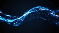 Glowing blue wave of magical light particles flowing on dark background, sparkling energy stream effect creates dynamic motion trail. Abstract design element.