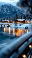 Cozy wooden cabins with warm glowing windows nestled along snowy riverbank at dusk, mountain backdrop and illuminated bridge reflecting on calm water surface.