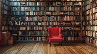Red velvet armchair stands alone against floor-to-ceiling bookshelves in private library, wooden flooring reflects warm lighting, creating cozy reading atmosphere.