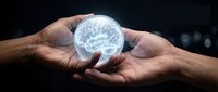 Man holding glowing brain sphere in hands against dark background, representing intelligence, innovation, and artificial intelligence technology concepts.