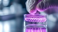 Glowing purple DNA helix floating in glass container against blurred background, futuristic genetic research concept with dramatic lighting effects.