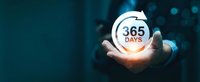 Business professional holding glowing 365 days circular arrow symbol representing annual cycle, yearly planning, and continuous service commitment.