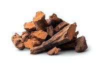 Pile of red pine bark chunks and pieces isolated on white background, natural organic mulch material for gardening and landscaping purposes.