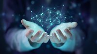Hands holding glowing digital network with connected nodes and lines, representing data connectivity, technology innovation, and cloud computing solutions for business applications.
