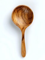 Handcrafted wooden serving spoon with round bowl shape and natural grain pattern, isolated on white background for culinary and kitchenware design.