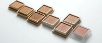 Luxury makeup blush palette collection in nude pink tones with golden compact cases arranged on white background for cosmetic branding and beauty campaigns.