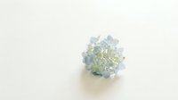 Delicate blue hydrangea flower cluster on a clean white background, soft pastel tones, minimalist floral composition for cards and decor.