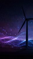 Wind turbine silhouette against starry night sky with purple blue energy waves and glowing particles representing sustainable renewable power generation.