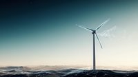 Majestic wind turbine against dramatic sky and rolling hills, generating renewable energy in misty morning light. Clean power technology meets nature.