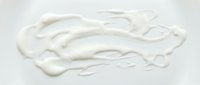 Creamy white paint stroke or cosmetic product smear isolated on white background, ready for design, packaging, and beauty marketing use.