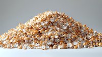 Fresh popped buttery popcorn heap on gray background, macro close up view of fluffy white and golden kernels for cinema and snack concepts.