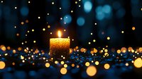 Glowing golden candle with magical bokeh lights on dark background creates atmospheric mood for spiritual, holiday, or romantic designs.
