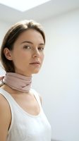 Young Caucasian woman in white tank top and pink silk scarf looking confidently at camera in modern minimalist interior space for lifestyle content.