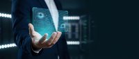 Businessman holding futuristic holographic interface with digital data visualization in modern server room for technology presentations.