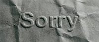 Word Sorry embossed on crumpled gray paper texture, conveying apology, regret, and forgiveness concepts for greeting cards and social media.