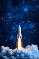 White rocket launching through clouds against starry night sky with bright blue nebula, dramatic fire blast from engines creating illuminated smoke trail.