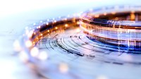 Abstract circular light trails in blue and orange creating futuristic technology pattern on white background, modern digital concept for business and innovation.