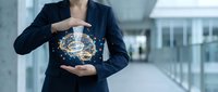 Businesswoman in dark blazer holding glowing digital globe network, representing global connectivity, international business, and technology innovation for corporate communications.