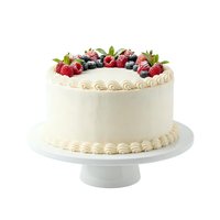 Elegant cream layer cake topped with fresh raspberries and blueberries on white pedestal stand, perfect for bakery, dessert, celebration and wedding design projects.