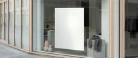 Blank white poster mockup in modern retail store window display with wooden frame and glass panels for advertising and promotional content.