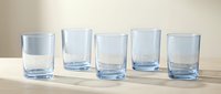 Five empty clear glass tumblers arranged in row on wooden surface against neutral background for kitchen and dining concepts.