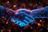 Digital handshake with glowing blue and orange particles forming network connections on dark background, symbolizing business partnership and technology agreement.