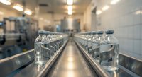 Professional commercial kitchen interior with stainless steel equipment and modern ventilation system for restaurant food service industry operations.