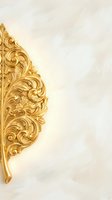 Ornate golden baroque decorative corner element with intricate scrollwork and floral motifs on cream textured background for luxury design projects.