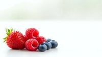 Fresh mixed berries strawberry raspberry blueberry on white background isolated for healthy eating organic food design nutrition concept.
