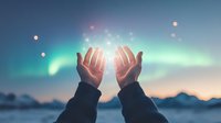 Raised hands catching magical light against aurora borealis sky at dusk, spiritual healing energy concept with glowing particles and northern lights background.