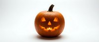 Carved orange pumpkin jack-o-lantern with glowing triangular eyes and smiling mouth on white background for Halloween decorations and autumn celebrations.