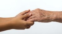 Young and elderly hands holding together, symbolizing care, support, and intergenerational connection, isolated on white background.