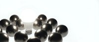Metallic spheres surrounding a single silver fork on white background, representing uniqueness, leadership, and standing out from the crowd for business concepts.