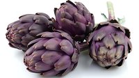 Fresh purple artichokes on white background, perfect for food photography, restaurant menus, and healthy eating lifestyle content, showing natural organic produce in vibrant colors.