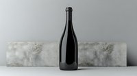 Dark glass wine bottle against minimalist concrete background with dramatic lighting and shadows creating modern composition for luxury beverage marketing.