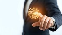 Businessman in dark suit touching glowing leaf icon symbolizing sustainable business practices, eco-friendly innovation, and environmental responsibility for corporate growth.