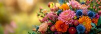 Vibrant autumn flower bouquet with colorful dahlias, chrysanthemums and seasonal blooms in warm sunlight for fall decorating and celebrations.