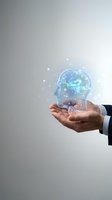 Businessman hand holding glowing holographic brain with neural network connections and sparkling particles on gray background for AI technology concepts.
