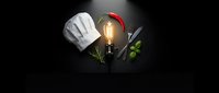 Chef hat with glowing light bulb, kitchen utensils and herbs on dark background representing culinary creativity and cooking innovation concepts.