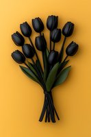 Dramatic bouquet of black tulips tied with ribbon against vibrant yellow background. Elegant floral arrangement for gothic or modern design concept.