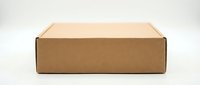Brown cardboard shipping box isolated on white background for packaging and delivery services, e-commerce and postal applications.