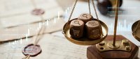 Wooden balance scale with e-commerce symbols weighing online shopping concepts against traditional retail in warm lighting setup.